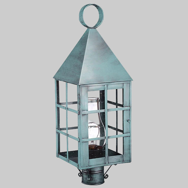 Decorative lantern with a metallic finish on a gray background