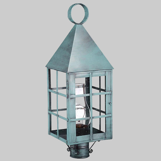 Decorative lantern with a metallic finish on a gray background