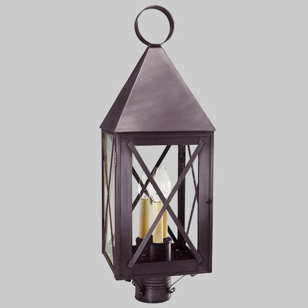 Decorative outdoor lantern with glass panels on a gray background