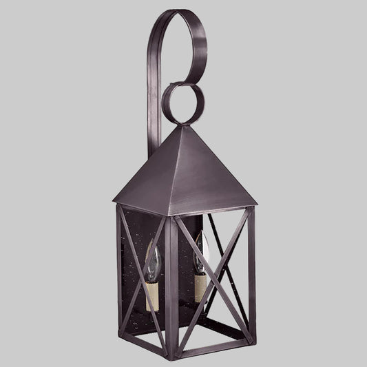 Decorative metal wall lantern on a white background
