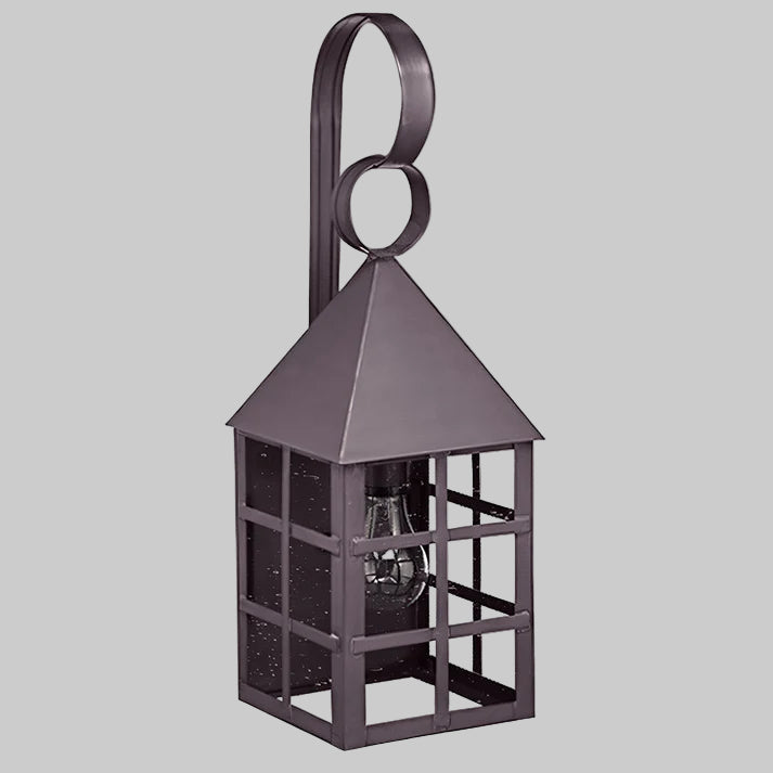 Decorative metal lantern with a circular handle on a gray background