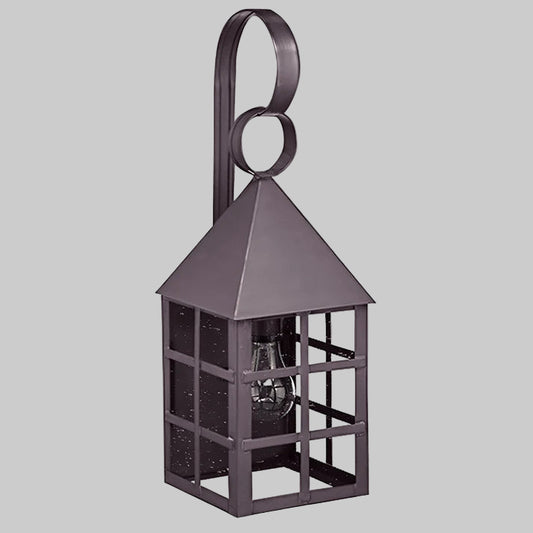 Decorative metal lantern with a circular handle on a gray background
