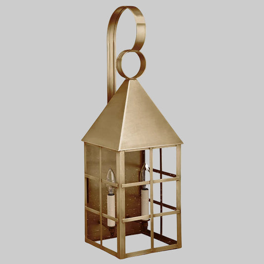 Gold lantern with a decorative handle on a white background