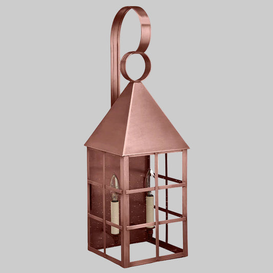Copper lantern with a decorative handle on a white background