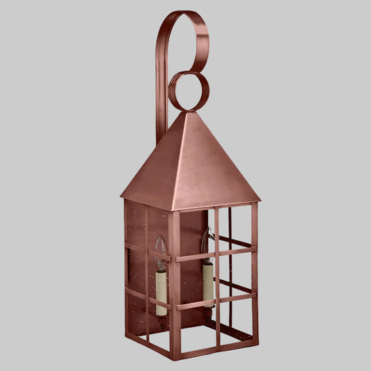 Copper lantern with a decorative handle on a white background