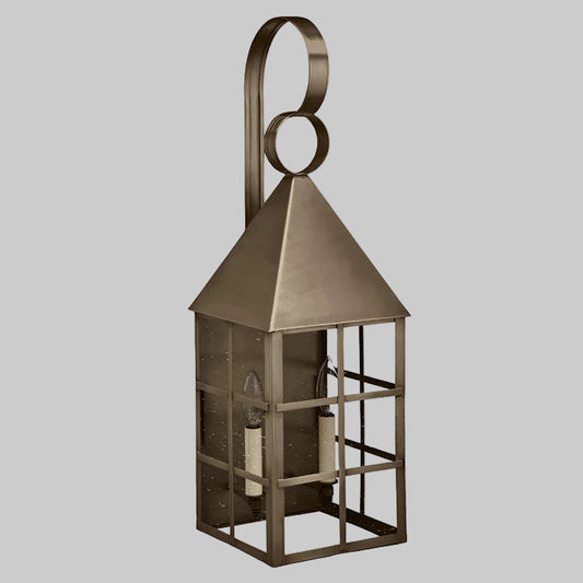 Bronze lantern with a decorative handle on a white background