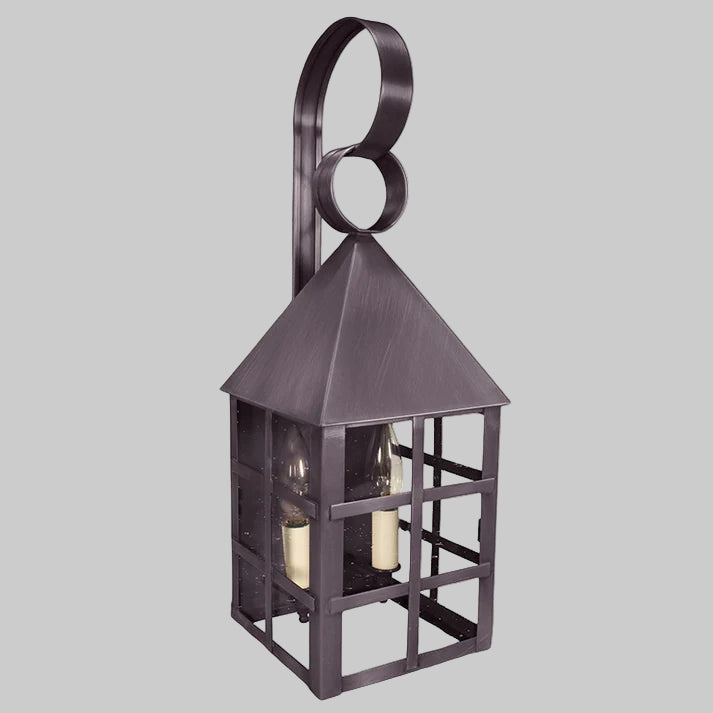 Decorative wall lantern with a dark bronze finish on a gray background