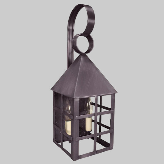 Decorative wall lantern with a dark bronze finish on a gray background