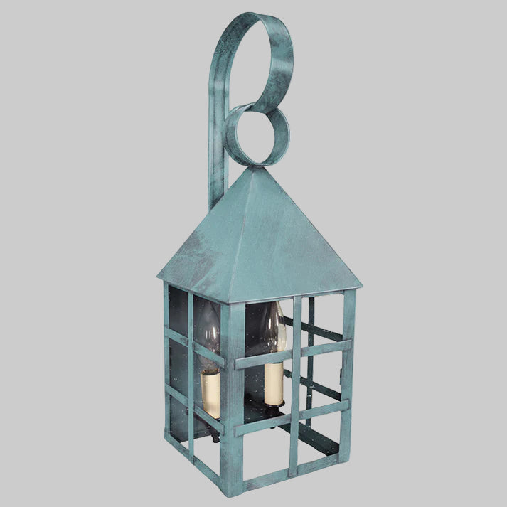 Decorative lantern with a metallic finish on a gray background