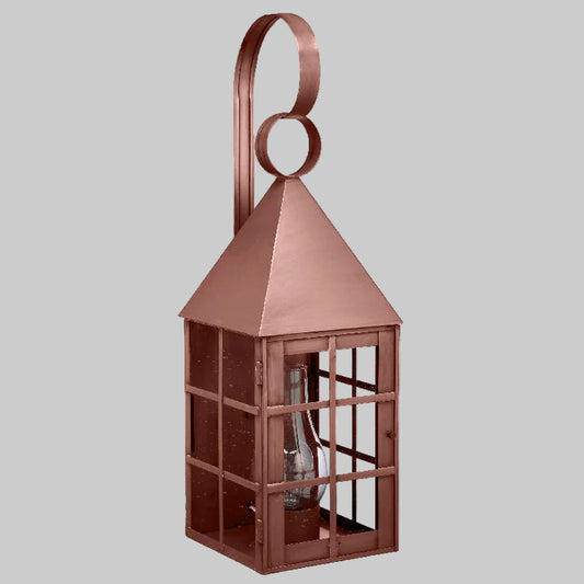 Copper lantern with a geometric design on a gray background