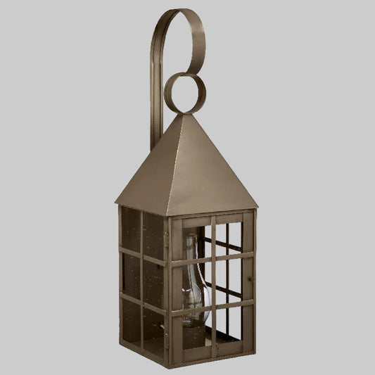 Bronze lantern with a geometric design on a gray background