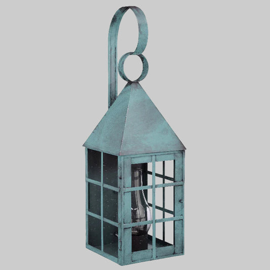 Decorative verdi gris lantern with a handle on a light gray background