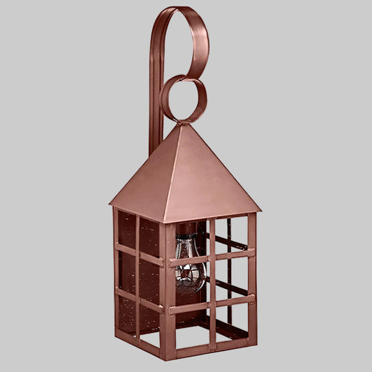 Copper-colored lantern with a clear bulb inside on a gray background