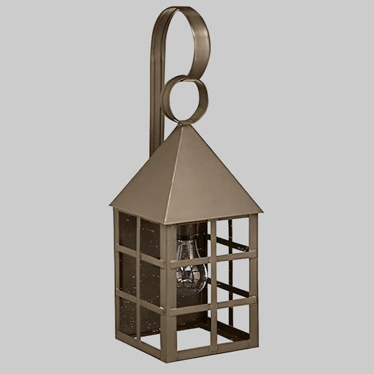 Bronze lantern with a light bulb inside on a gray background