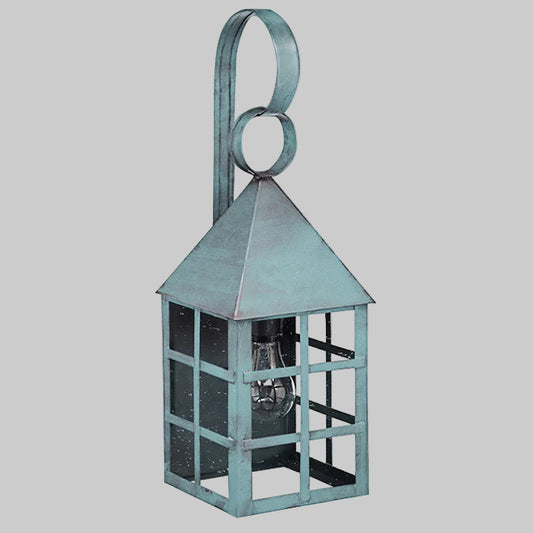 Decorative lantern with a metallic finish on a gray background