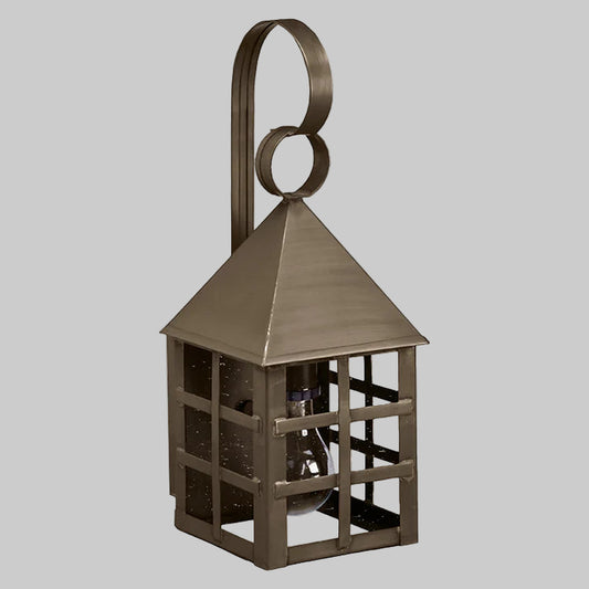 Bronze-colored lantern with a geometric design on a gray background