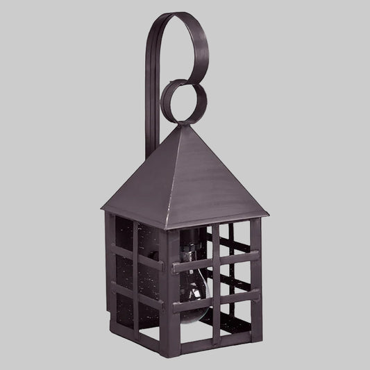 Decorative metal lantern with a handle on a gray background