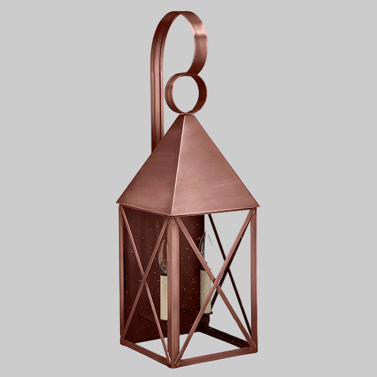 Copper lantern with geometric design on a gray background