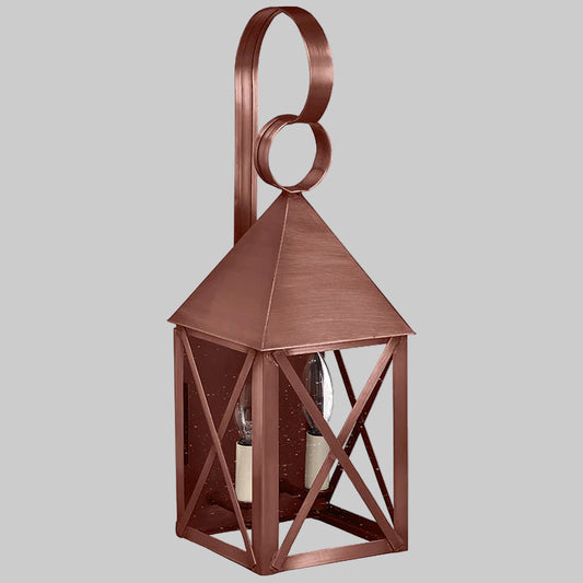 Copper lantern with a decorative top on a gray background