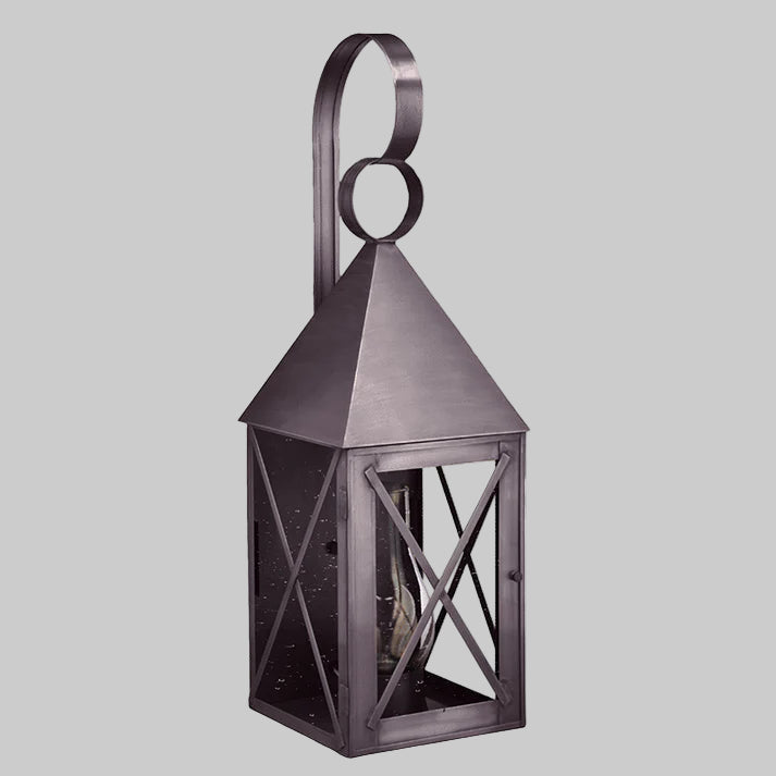 Decorative metal lantern with a handle on a gray background