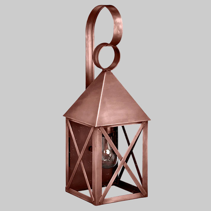 Copper lantern with geometric design on a gray background