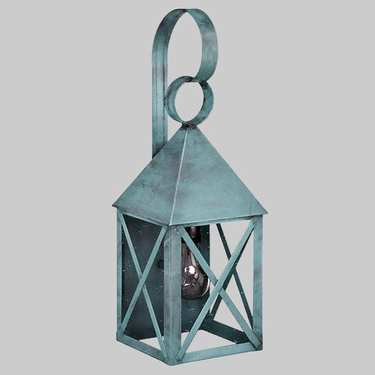 Decorative green lantern with circular handle on a gray background